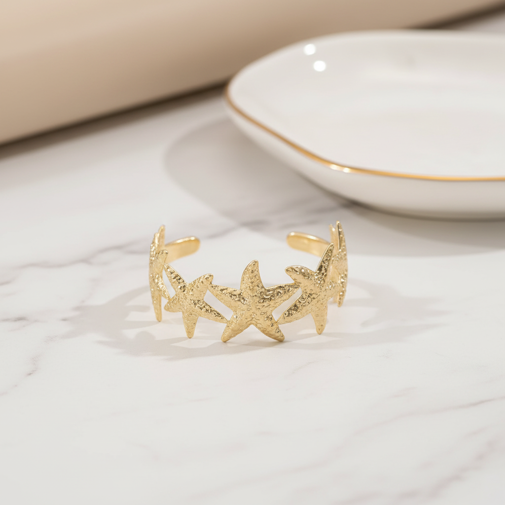 Golden tone starfish cuff bracelet
