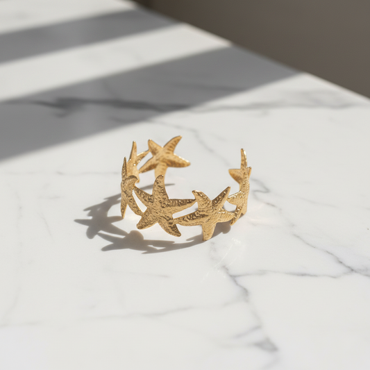 Golden tone starfish cuff bracelet